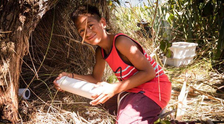 Young Guardian of the Bay of Island volunteer with tracking tunnel 720 x 400