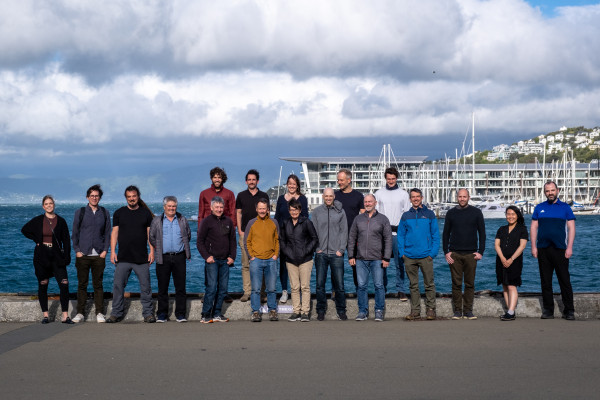 Team of Xerra employees stand on Wellington's waterfront